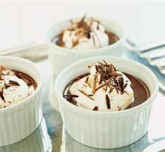 Chocolate Pot de Creme topped with cream and chocolate shavings