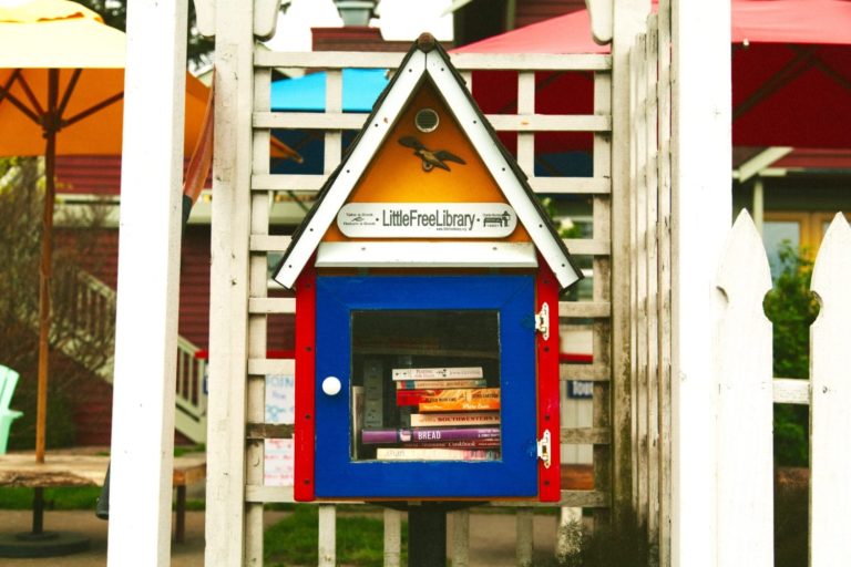 Brightly painted little library cabinet