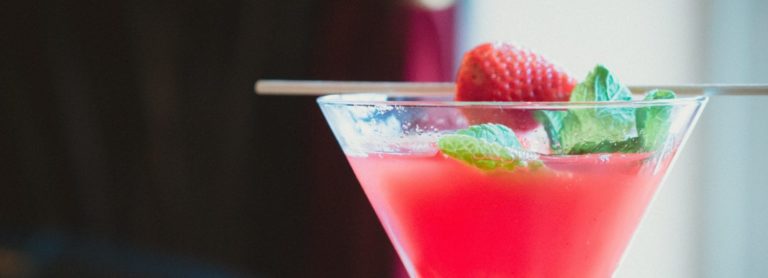 strawberry and mint cocktail in a martini glass