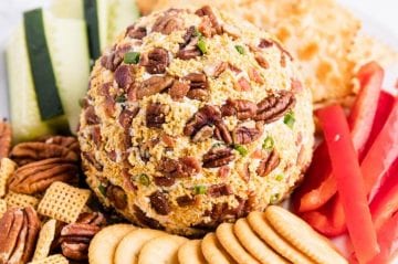 cheese ball served with chex mix and crackers