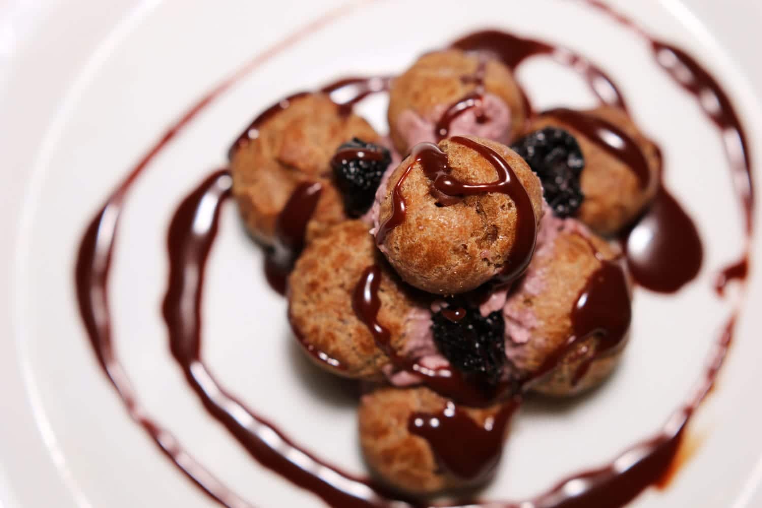 Pastry drizzeled with chocolate sauce