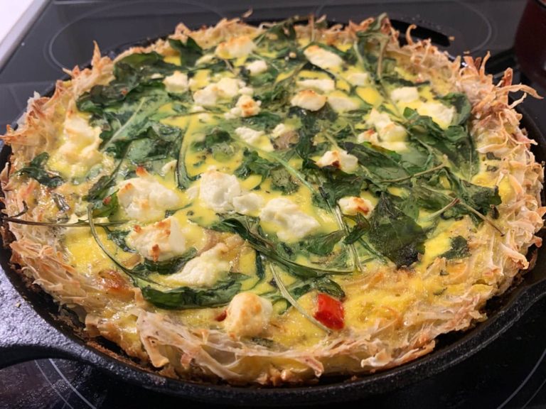 Quiche cooked in a cast iron pan