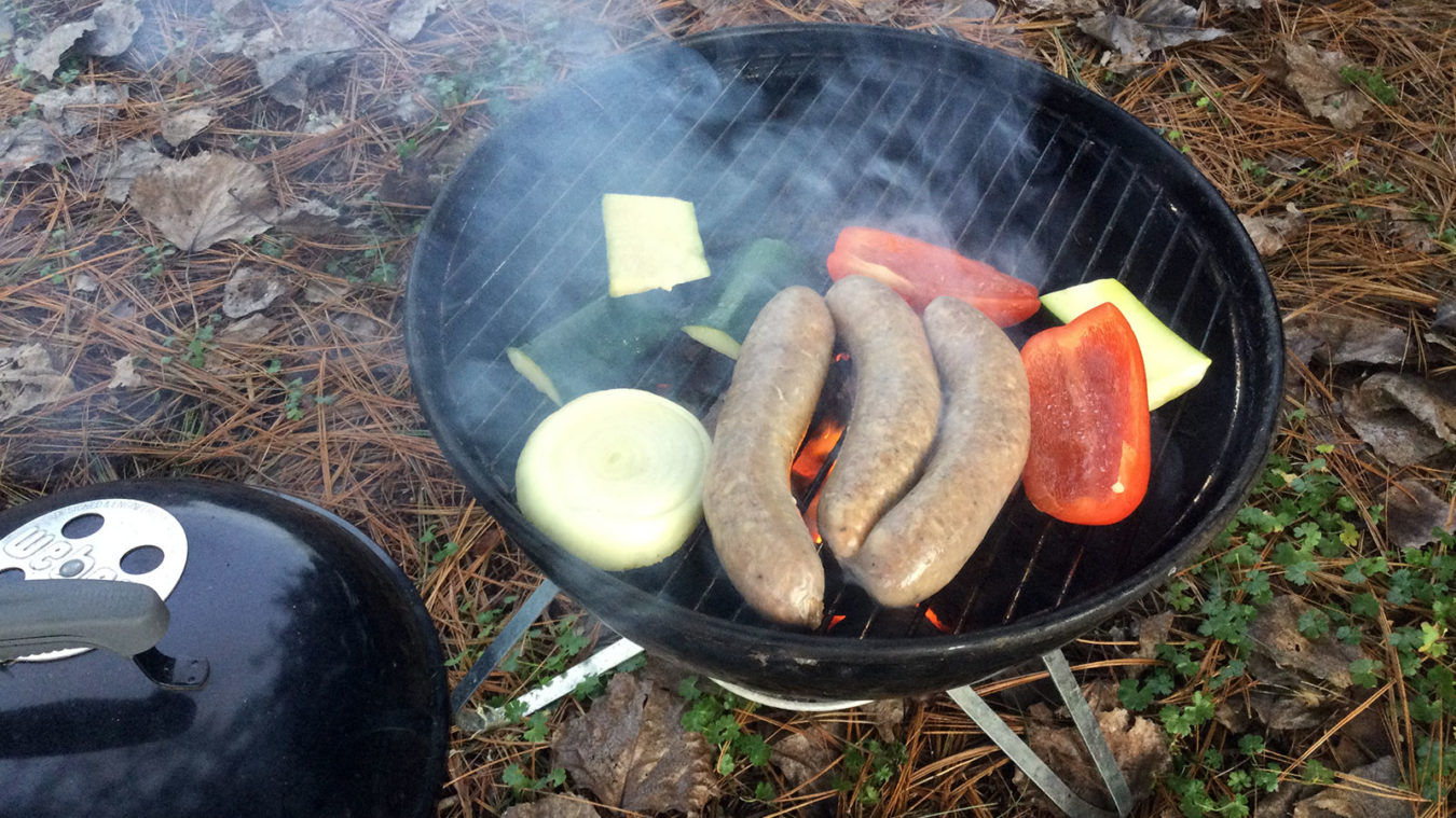 grilling sausages and vegetables