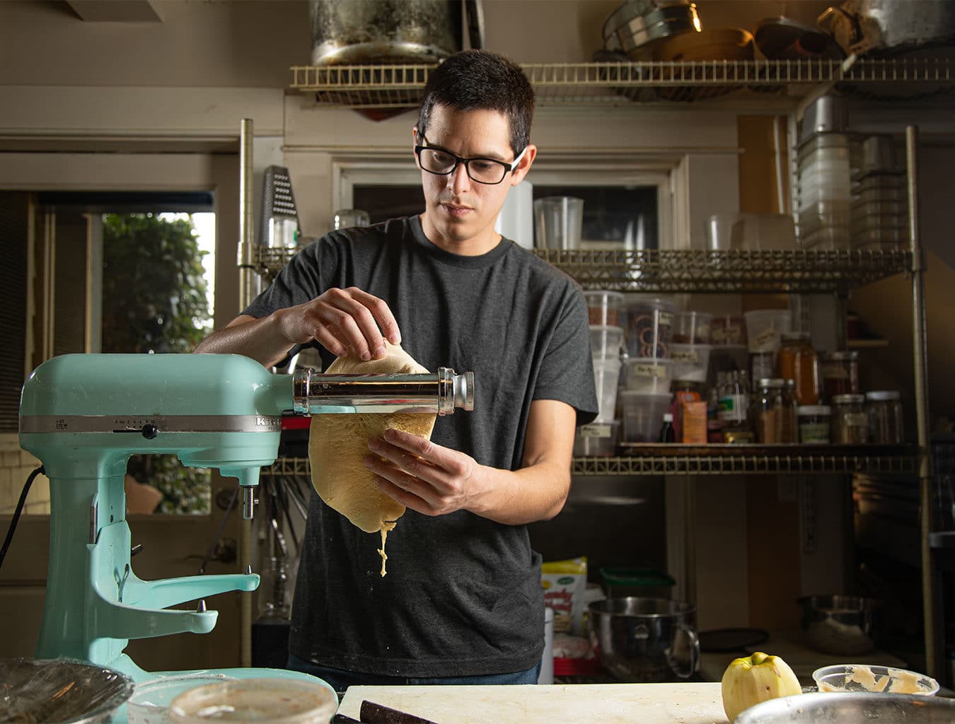 man rolling pasta using a kitchenaid