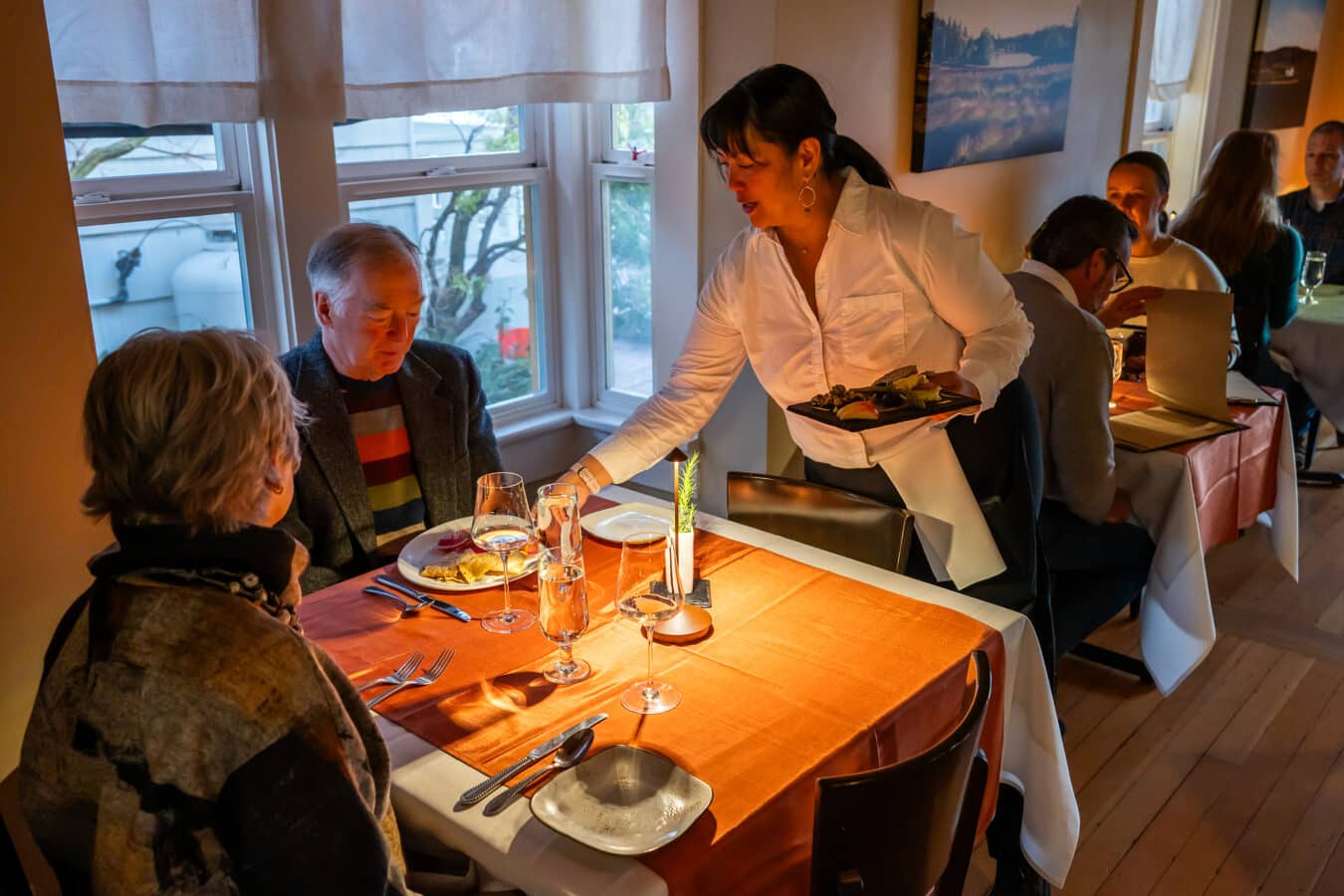 server presenting meals