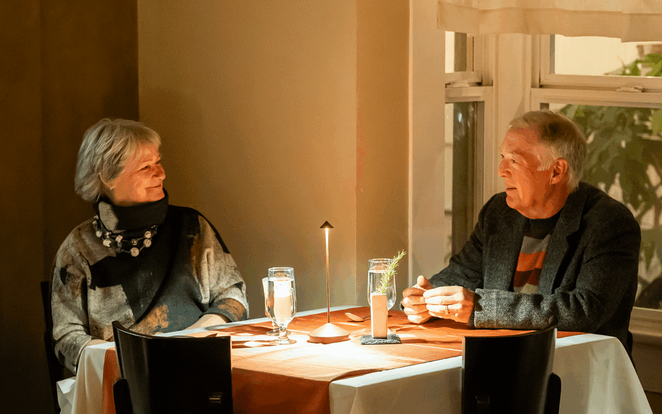 two people seated in a restaurant